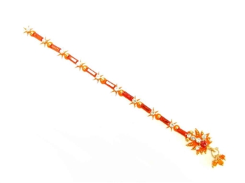 Bright orange with sparkling white crystals in a long tikka style.