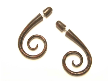 Two inch long fake gauges with a spiral at the bottom in wood.