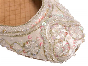 Warm white ivory silk with iridescent beads and sequins with gold threadwork.