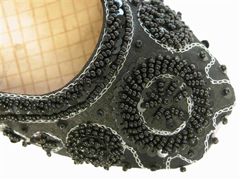 Black silk flat shoes with matching beading and contrasting silver threadwork.