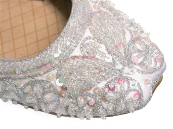 Wedding shoes in silvery white silk with iridescent beads and sequins.
