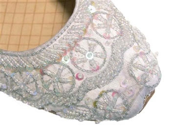 Wedding shoes in silvery white silk with iridescent beads and sequins.