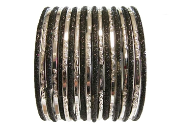 Solid black glitter bangles pair with metallic silver glass bangles.