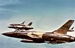 Photo of Republic F-105 Thunderchief fighter bombers on a mission high over the jungles of Vietnam