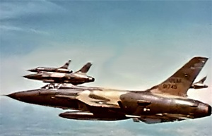 Photo of Republic F-105 Thunderchief fighter bombers on a mission high over the jungles of Vietnam