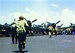 Color photo of Navy pilots scrambling to their planes on the deck of The Fighting Lady aircraft carrier during World War 2.