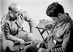 A serviceman undergoes hypnosis during treatment