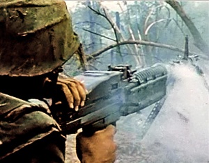 Photo of a Marine operating an M60 machine gun in the Vietnam war.