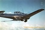 Color photo of a Navy North American SNJ Advance trainer taken from the film Naval Aviation Cadet.