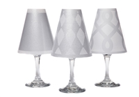 Set of 6 coordinating drum, scroll and solid pattern translucent paper white wine glass shades.  Available in silver and gold.  Made in the USA.