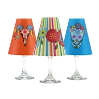 Set of 6 coordinating Day of the Dead holiday translucent paper white wine glass shades by di Potter.  Simple add a tea light to a wine glass to create simple table decor.  Made in the USA