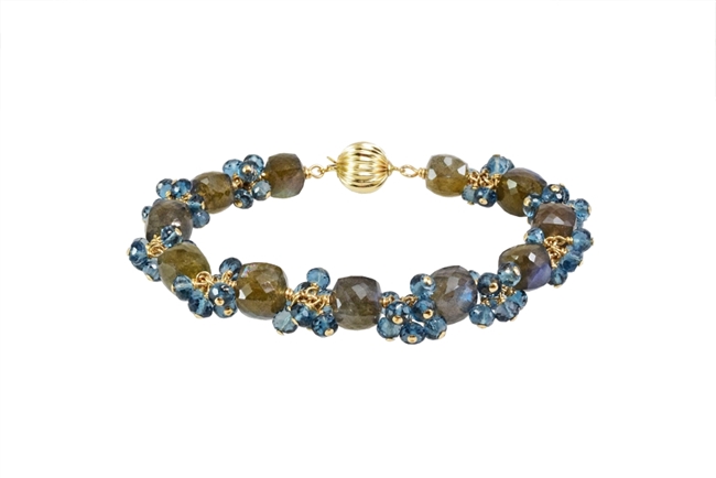 Hand Crafted, this Bracelet features uniquely cut "Cubed" Labradorite Gemstones, alternating with clusters of brilliant, faceted, London Blue Topaz Gemstones. These two Gemstones compliment each other  perfectly. Gold Filled Sterling Chain & Latch.