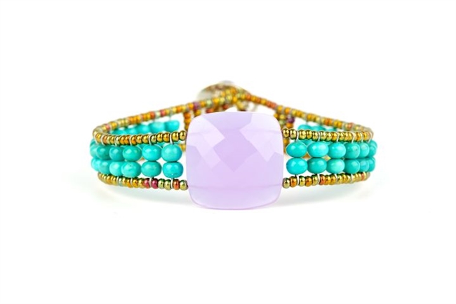 Ziio's Armonia Tennis Bracelet features a large Violet Amethyst Gemstone at the center with Blue Turquoise Gemstones on the band. Gold Murano Glass seed Beads outline the band. 925 Sterling Silver Button Closure, adjustable in length.