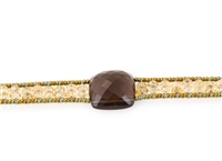 Ziio's Armonia Tennis Bracelet features a large Smokey Quartz Gemstone at the center with Gold Citrine Gemstones on the band. Gold Murano Glass seed Beads outline the band. 925 Sterling Silver Button Closure, adjustable in length.