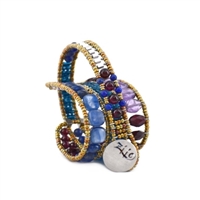 Ziio's new Evolution Bracelet is designed to fit any wrist, from child to adult. With an innovative fastening technique, it becomes a universal model for all. Hand crafted in Blue Kyanite. Lapis, Purple Amethyst & Garnet gemstones.