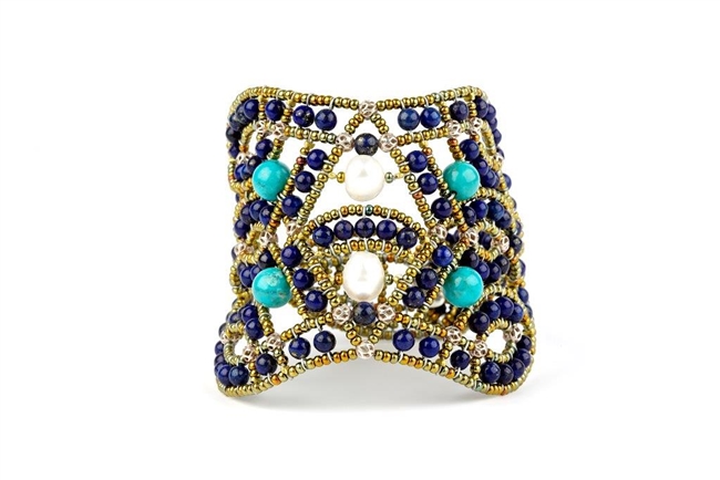 This beautiful Lapis Gemstone Cuff Bracelet is hand crafted by Ziio and features an intricate net/lace design, hi-lighted at the center with Turquoise Beads & White Water Pearls. Made with stainless steel wire & golden Murano Glass seed Beads.