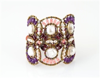 From Ziio's Permanent Collection, this statement Cuff Bracelet is a head turner. Large White Freshwater Pearls are the focus of this design, accented by Purple Amethyst & Pink Howlite Gemstones. Silver and Murano Glass Beads. Sterling Silver Button Closur