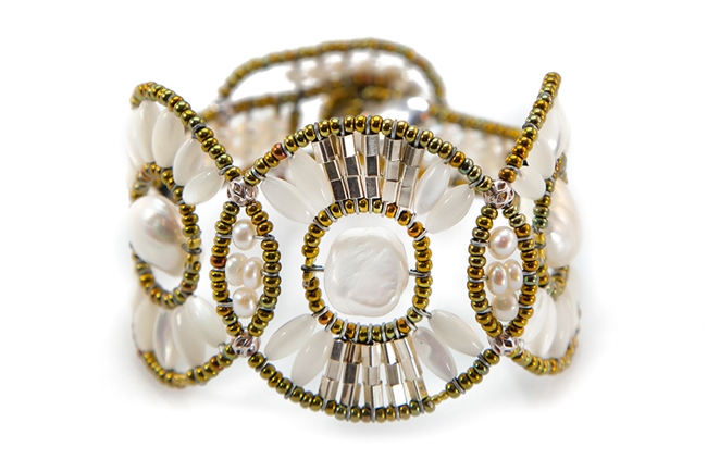 From Ziio's Permanent Collection, this Cosmic Cuff Bracelet is perfect for those who want unique. Large White Baroque Freshwater Pearls are the focus of this design, accented by White Mother of Pearl Beads, Silver beads & Onyx Gemstones. Hand crafted in