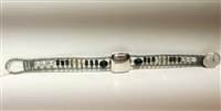 Tennis Bracelet features a large, square Sterling Silver Bead at the center. The band is in Black Tourmaline & Zirconia Gemstones, Grey Pearls & Silver Beads. Hand crafted in Italy it is on Stainless Steel wire with Grey Murano Glass seed Beads.