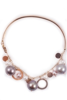 unique Pearl Bangle Bracelet by Zoccai. The back wrist band is a hard Bangle in 18k Rose Gold. The front of the Bracelet is Gold chain filled with multi-sized Pink, Grey & White Pearls mixed with circular Gold Charms. Pearls vary from 3mm to 8.5mm.