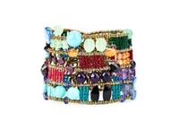 The "Cici" Cuff Bracelet by Ziio is a masterpiece of rich multi-colored Gemstones. Purple Amazonite & Amethyst, Green Chrysophrase, Red Garnet, Blue Kyanite, Iolite, Lapis & Agate, Orange Carnelian - beautifully blended together and accented