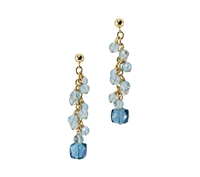 These cascading Blue Gemstone Earrings are sure to delight. The spiral drop of Aquamarine Gemstones ends with a uniquely cut, cubed, London Blue Topaz. Hand crafted in the U.S. by Silver Pansy. The Drop Earrings are in Gold filled Sterling Silver.