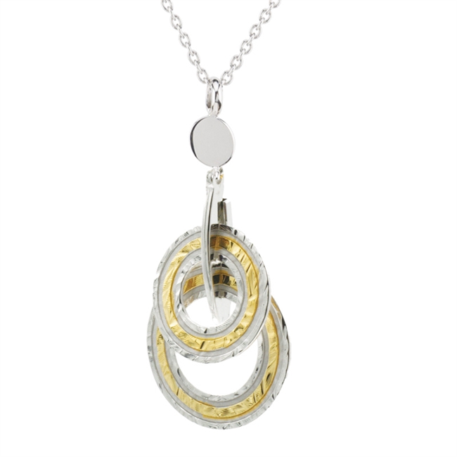 This tow-tone Sterling Silver Pendant Necklace by Frederic Duclos will easily become your go-to piece. Crafted in Yellow Gold plated and White Sterling it features two drop rings graduating in size. Sterling Silver chain with Lobster Clasp, 16 to 18 inch