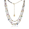 Petal-shaped multi-colored Sapphire and Emerald tear drop Gemstone clusters on three strands of Oxidized diamond cut Sterling Silver chain with 14k gold-plated half moon details. 16"-18" adjustable. Made in San Francisco by Mabel Chong.