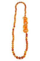 Long Carnelian Gemstone Necklace made in Italy, by Rajola. The Necklace is accented with interlocking infinity rings of Carnelian Seed Beads that can be worn asymmetrically or at the bottom. 18K Gold Chain Accents & logo. No latch. Length 33"