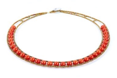From Ziio's Permanent Collection, this single strand simulated Coral Necklace is a classic with Italian style. Framed with golden Murano Glass seed beads, this piece has a fresh, new look and can easily be dressed up or down. Made in Italy