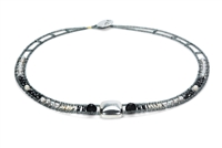 Necklace features a large, square Sterling Silver Bead at the center. The neck band is in Black Tourmaline & Zirconia Gemstones, Grey Pearls & Silver Beads. Hand crafted in Italy it is on Stainless Steel wire with Grey Murano Glass seed Beads.