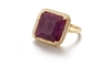 Known for her custom, one-of-a-kind pieces, this Ruby Ring by DyanneBelle is one to covet. The emerald cut African Ruby (purple/red in color - aprox 22ctw)) is stunning and set off by a pave of 0.36ctw White Diamonds framing it. Made in 14k Gold. Size 7.