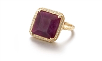 Known for her custom, one-of-a-kind pieces, this Ruby Ring by DyanneBelle is one to covet. The emerald cut African Ruby (purple/red in color - aprox 22ctw)) is stunning and set off by a pave of 0.36ctw White Diamonds framing it. Made in 14k Gold. Size 7.