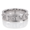 Tuum's Decem Infinity Ring represents their innovative interpretation of the rosary ring. It has 10 raised and beaded M's circling around the ring, representing the Ave Maria, that are spaced by a single cross. White Rhodium Plated Sterling Silver