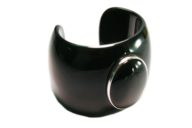 Bold & beautiful in it's simplicity. This is a black Acrylic Cuff Bracelet embellished with a large Black Onyx Gemstone Cabochon framed in a White Sterling Silver ring. Made in Italy by Sanalitro. Width 2 1/4". Size Md.