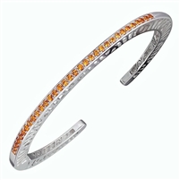 Narrow stacking Bangle. Solid Sterling Silver inlaid with 33 (2ct) 1.7mm Orange Spessartite Garnet Gemstones.Beautiful open work design along the sides with designer, Martha Seely's, signature interlocking spirals. Hinged on one side for good fit. 4mm