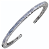 Narrow stacking Bangle inlaid with 33 Swiss Blue Topaz Gemstones (2ctw). Open work design along the side edges - pierced with designer Martha Seely's signature interlocking spirals. Hinged on one side for ease of fit. 4mm Wide. Rhodium plated solid 925 SS