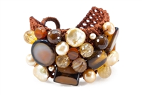 A wonderful medley of Gemstones & Pearls woven onto a cord backing to create this Cuff Bracelet by Rajola. Multiple shapes of Golden Pearls, Tiger Eye, Citrine & Carnelian create this art-to-wear piece. Button closure, adjustable length, fits most wrists.