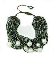 A stunning multi-strand Emerald Green Hematite Bracelet. Accented with White Fresh Water Pearls this Cuff Bracelet is beautiful statement piece. Made in Italy by Rajola. Toggle Clasp, easily adjustable, fits most wrists.