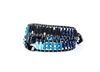 From Ziio's Twilight Collection. This double wrap Boa Bracelet is a beautiful blend of various hues of Blue outlined in Black. Lapis, apatite, Zircon, Black Tourmaline & Murano Glass Beads. 925 Sterling Silver Button Closure, adjustable in length.