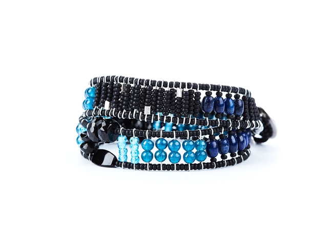From Ziio's Twilight Collection. This double wrap Boa Bracelet is a beautiful blend of various hues of Blue outlined in Black. Lapis, apatite, Zircon, Black Tourmaline & Murano Glass Beads. 925 Sterling Silver Button Closure, adjustable in length.