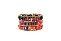 From Ziio's Twilight Collection, crafted in Italy, this wide Cuff Bracelet is a wonderful mix of shades of Red & Orange Gemstones and Black Gemstones. Garnet, Carnelian, Coral, Onyx, Tourmaline & Murano Glass Beads. 925 Sterling Silver Button Closure