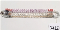 From Ziio's Mistinquett Collection, this bracelet is like no other. Double rows of Mother of Pearl & Seed Pearls are complimented by a fan-like effect of pinkish Bohemian Glass Beads and accented by Murano Glass Beads. 925 Sterling Silver Button