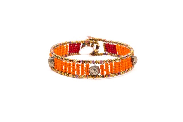 Ziio's Ovale Tennis Bracelet has Orange Beads & Pyrite. Hand-crafted in Italy. Made with Stainless Steel wire & multi-colored Murano Glass Beads. 925 Sterling Silver Button Closure, adjustable in length. Beautiful and fun, alone or stacked.