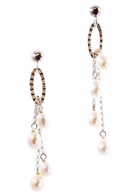 A Sterling Silver Hoop is inlaid with White Cubic Zirconia for a hint of sparkle and holds two Sterling Chains with a White Fresh Water Pearl at each end. Drop of the Pearls is changeable. Posts in 925 Sterling. Made in Italy by Claudio Faccin.