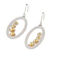 Two-tone Oval Drop Earring by Frederic Duclos. The Oval Hoop has a Frosted White finish and is finished with a row of four Golden Beads inside. Hooks. 925 Sterling Silver. L 1 1/2" X W 5/8"