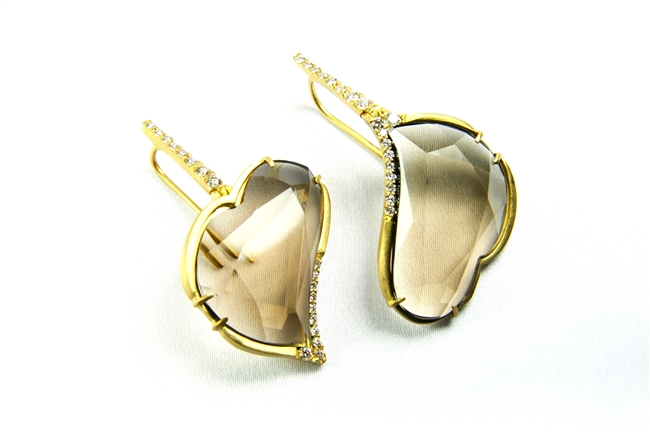 Hand crafted in Italy by J.Jewels, asymmetrical with one Smokey Quartz Heart Gemstone up and the other down. Inlaid with 0.57ctw of Pave White Diamonds at the crest of each Heart and up along the drop. 18k brushed Yellow Gold. Hooks. L 1 5/8" X W 1"