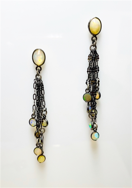 Beautiful long drop Earrings by Mabel Chong. A bezel set Opal Gemstone at the post holds six chain link drops of various lengths with Opals at each end. Made in 925 dark oxidized Sterling Silver. Length 2 1/2 inches. Made in the U.S.