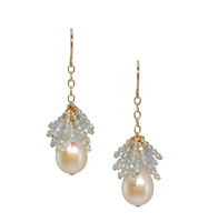 A beautiful White Fresh Water Pearl with a starburst of Sky Blue Aquamarine Gemstones above.  These drop Earrings are made in gold filled Sterling Silver by Silver Pansy. Made in the U.S. L 1 1/2" W 1/2"