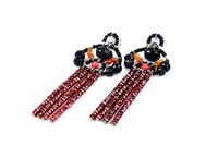 Beautiful long Tassel Earrings in Black & Red by Ziio. The posts feature Black Tourmaline Gemstones with Coral Glass Beads holding four Tassel drops of Rust Red Zircon Gems. Sterling Silver Posts. Hand crafted in Italy.